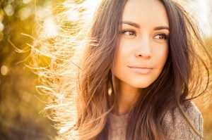 Outdoor atmospheric fashion photo of young beautiful lady in autumn landscape